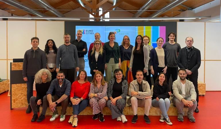 A group of professionals is posing in front of the camera to take a group photo.